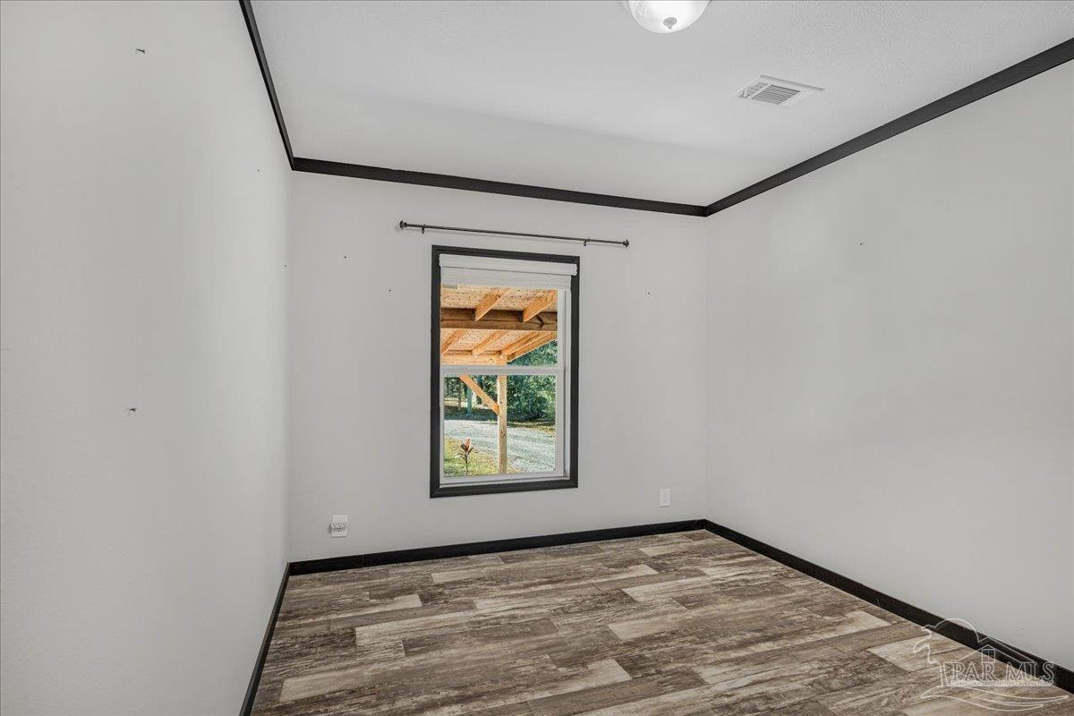 7789 Trinity Baptist Church Road Milton, FL 32570 - Photo 30 of 39 a view of an empty room with a window