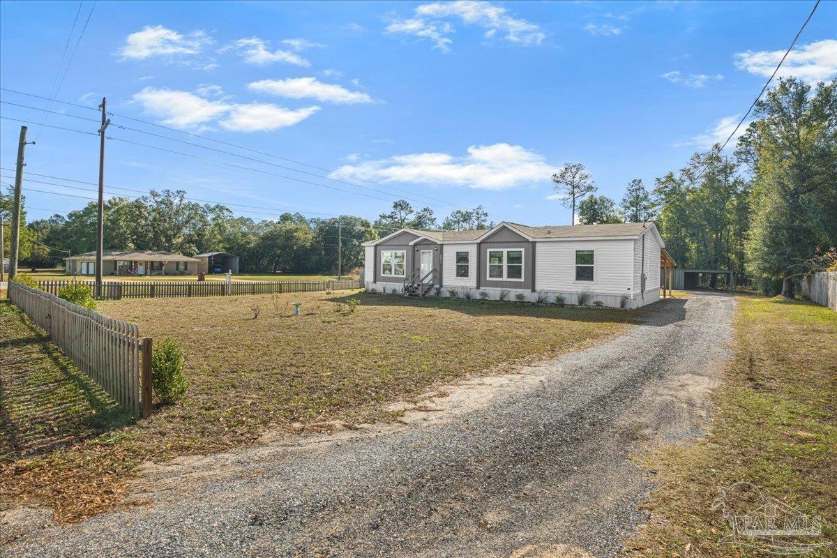 7789 Trinity Baptist Church Road Milton, FL 32570 - Photo 3 of 39 a view of a house with a yard