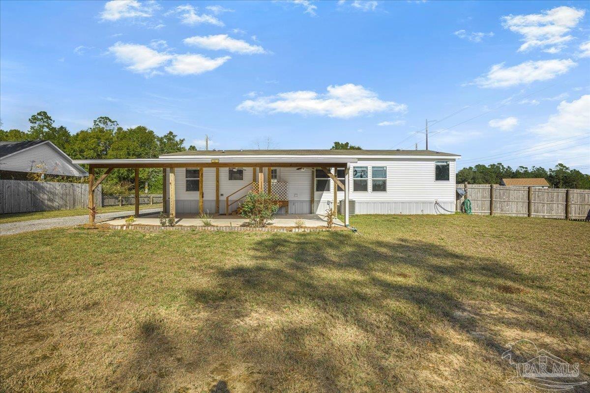 7789 Trinity Baptist Church Road Milton, FL 32570 - Photo 32 of 39 a view of a house with a backyard