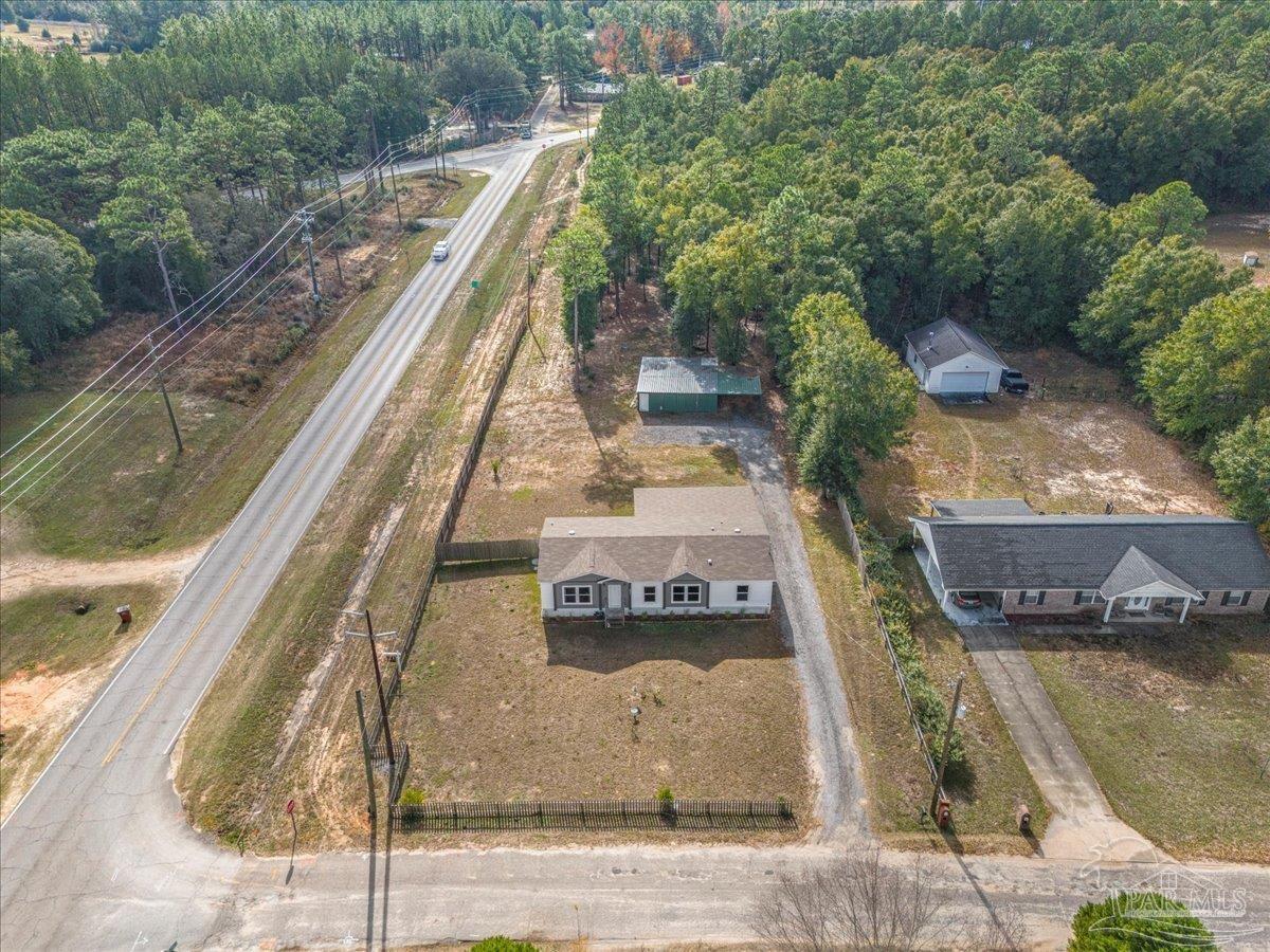 7789 Trinity Baptist Church Road Milton, FL 32570 - Photo 37 of 39 a view of a yard with large trees