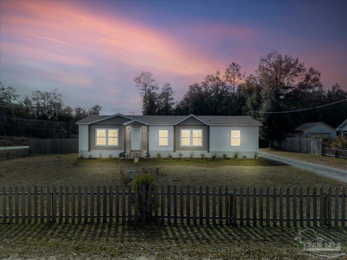 7789 Trinity Baptist Church Road Milton, FL 32570 - Photo 7 of 39 a view of a house with a yard