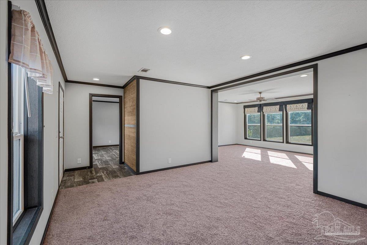 7789 Trinity Baptist Church Road Milton, FL 32570 - Photo 10 of 39 a view of an empty room with a window