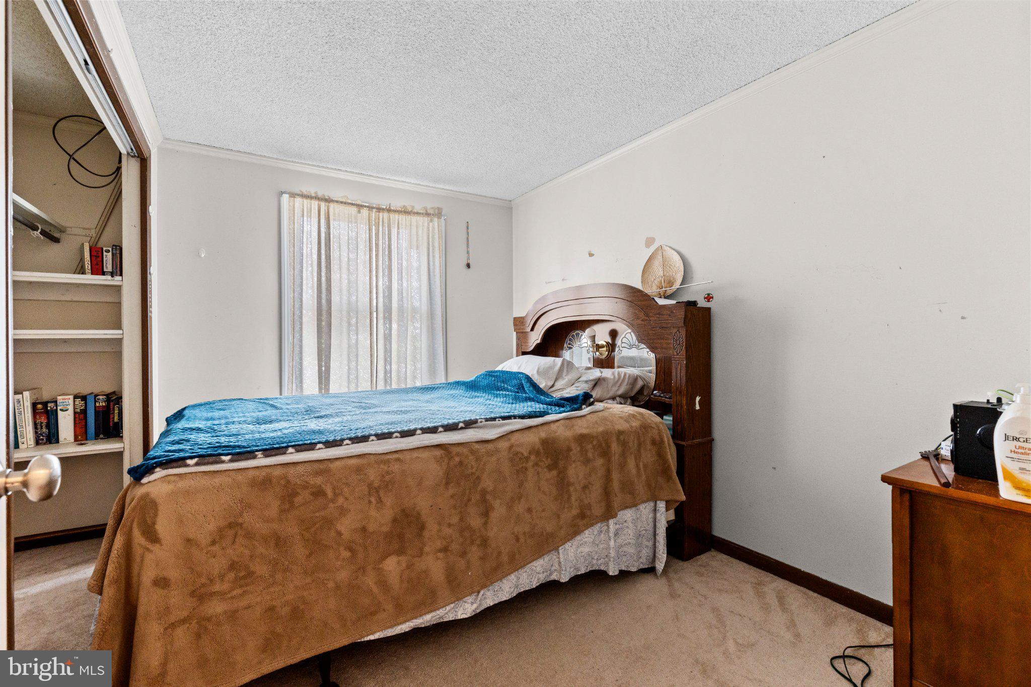 430 Fairview Road Manheim, PA 17545 - Photo 10 of 32 a bed sitting in a bedroom next to a window