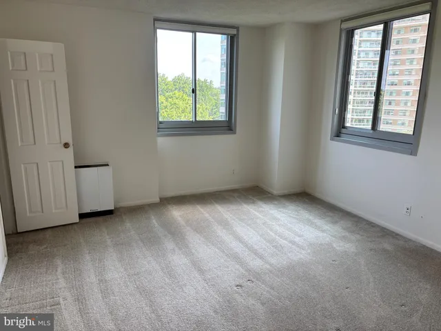 an empty room with windows