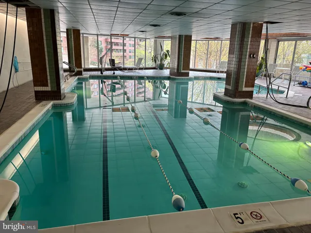 a view of swimming pool from a balcony