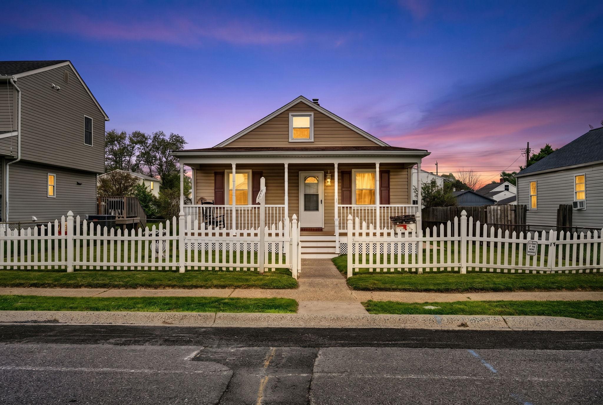 a front view of a house with a garden