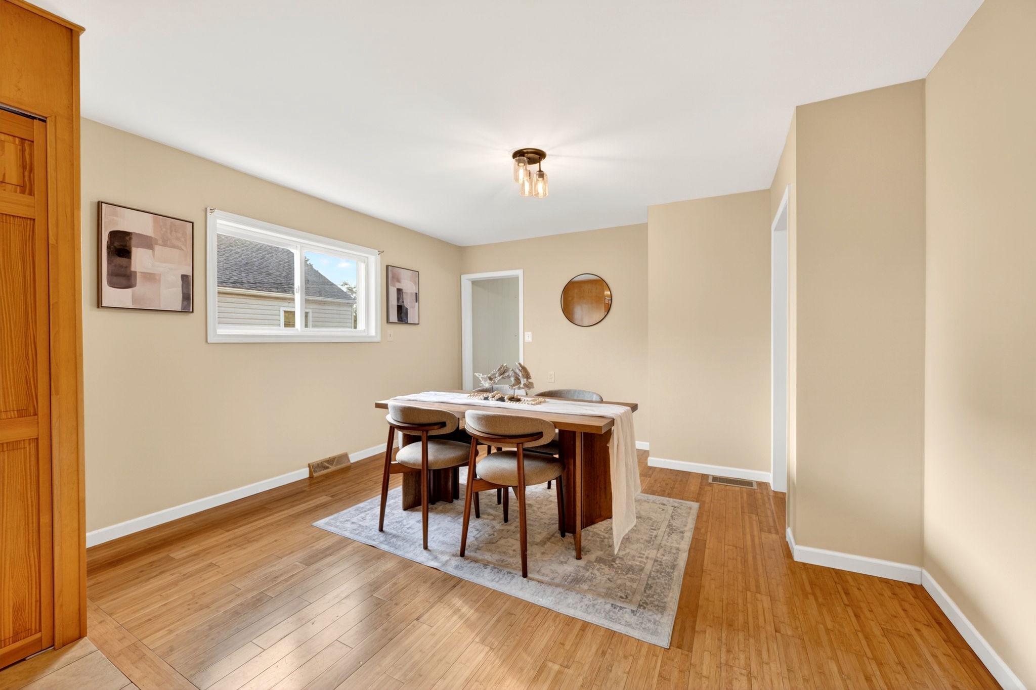 206 South Woodwell Road Baltimore, MD 21222 - Photo 15 of 46 a view of a dining room with furniture and wooden floor