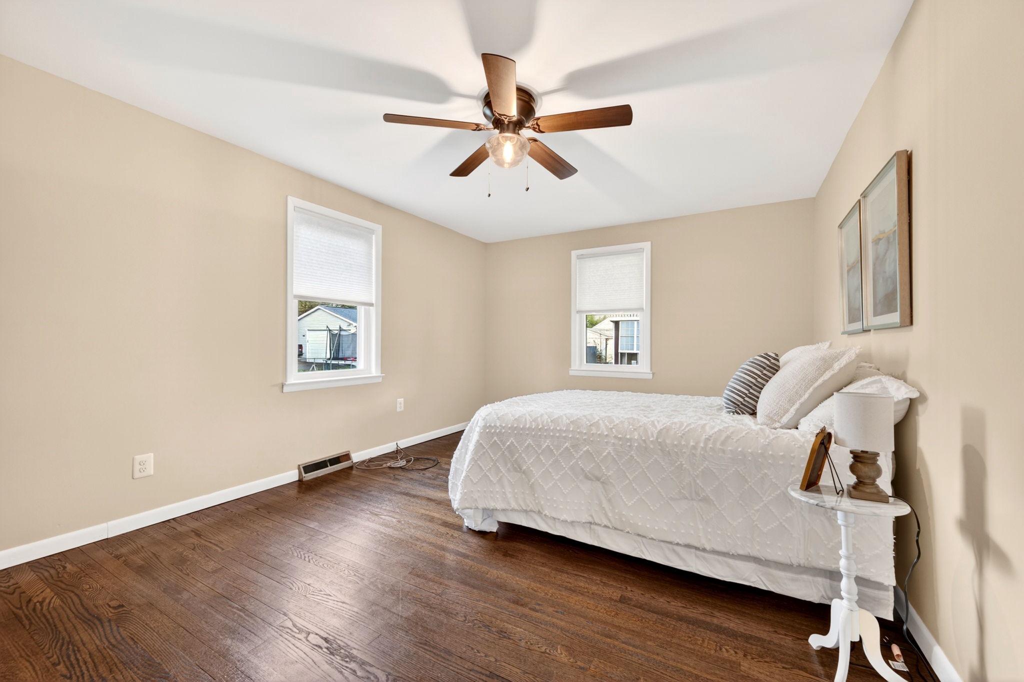 206 South Woodwell Road Baltimore, MD 21222 - Photo 19 of 46 a bedroom with a bed and window