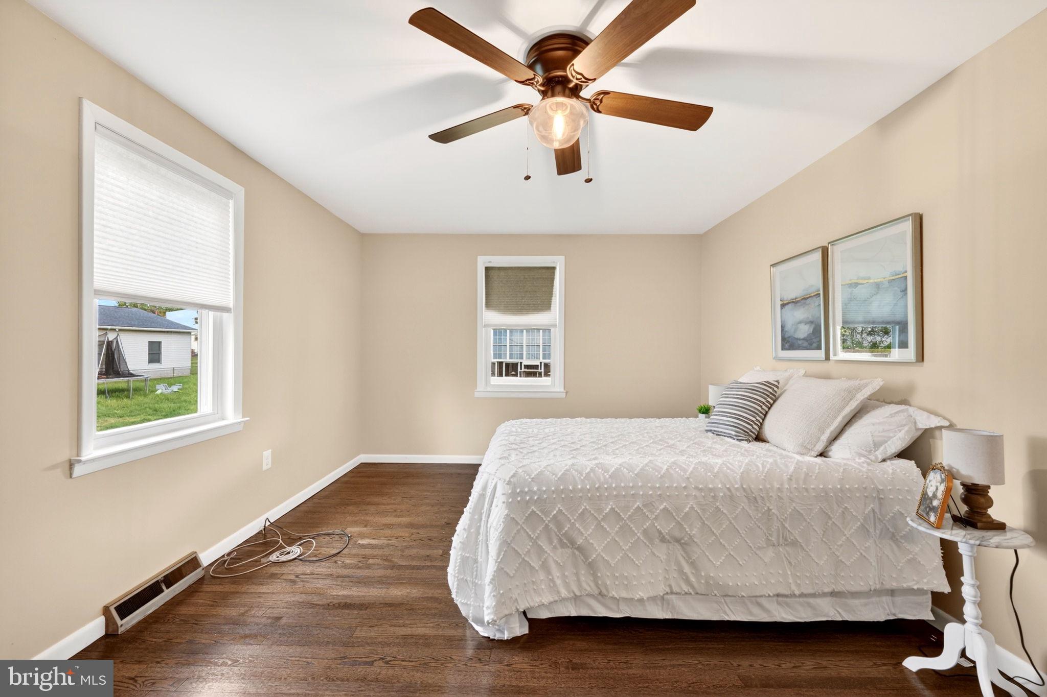 206 South Woodwell Road Baltimore, MD 21222 - Photo 20 of 46 a bedroom with a large bed and a window