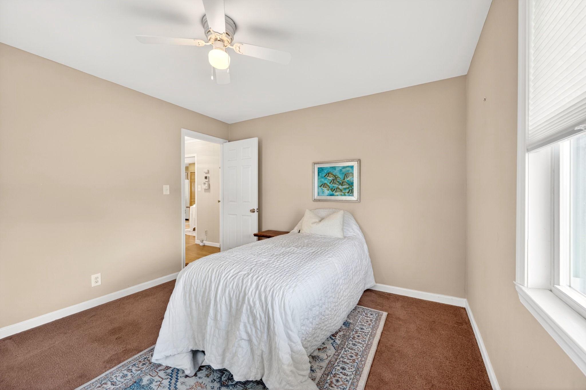 206 South Woodwell Road Baltimore, MD 21222 - Photo 22 of 46 a bedroom with a bed and a window