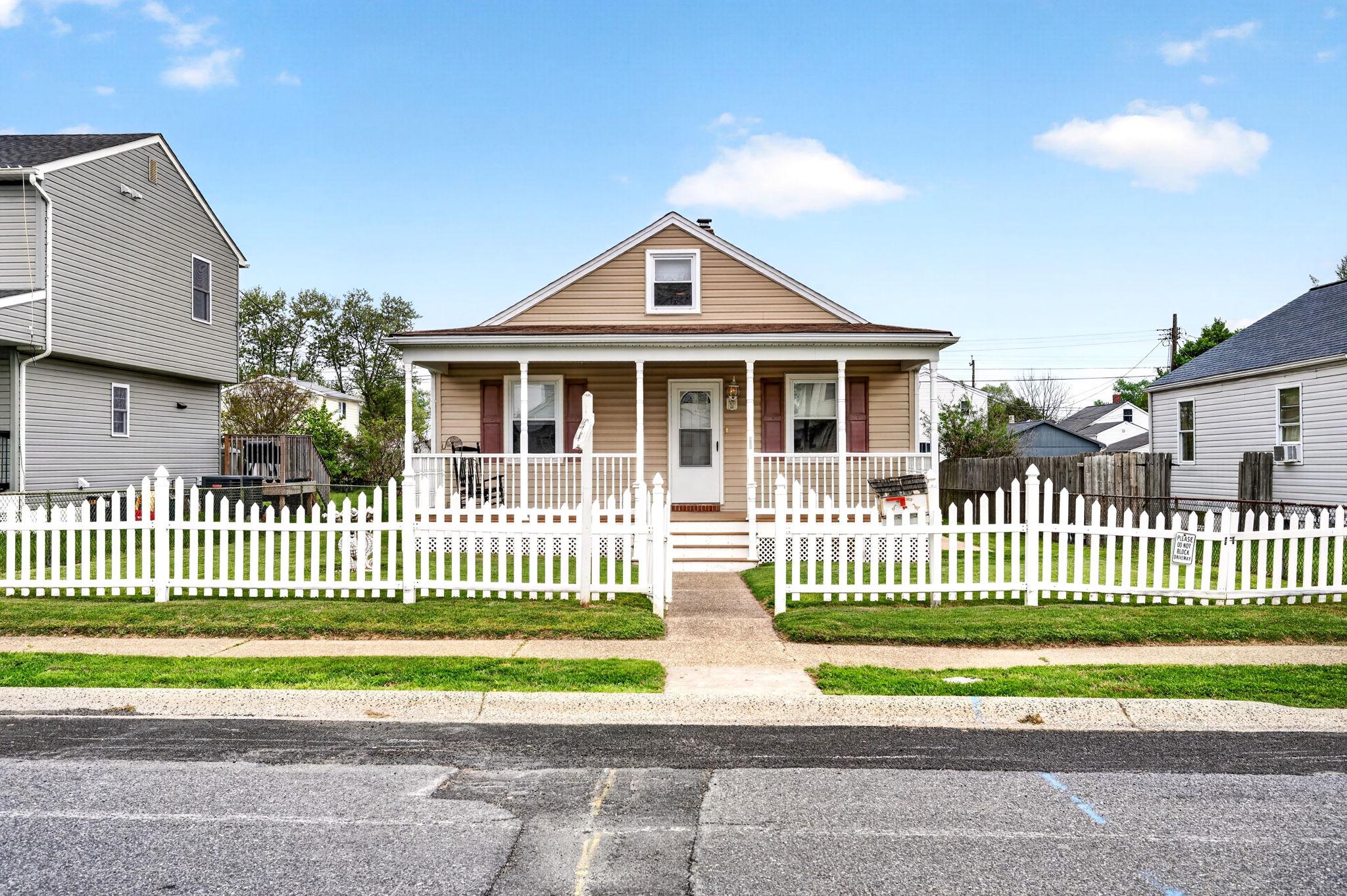 206 South Woodwell Road Baltimore, MD 21222 - Photo 3 of 46 a front view of a house with a garden and deck
