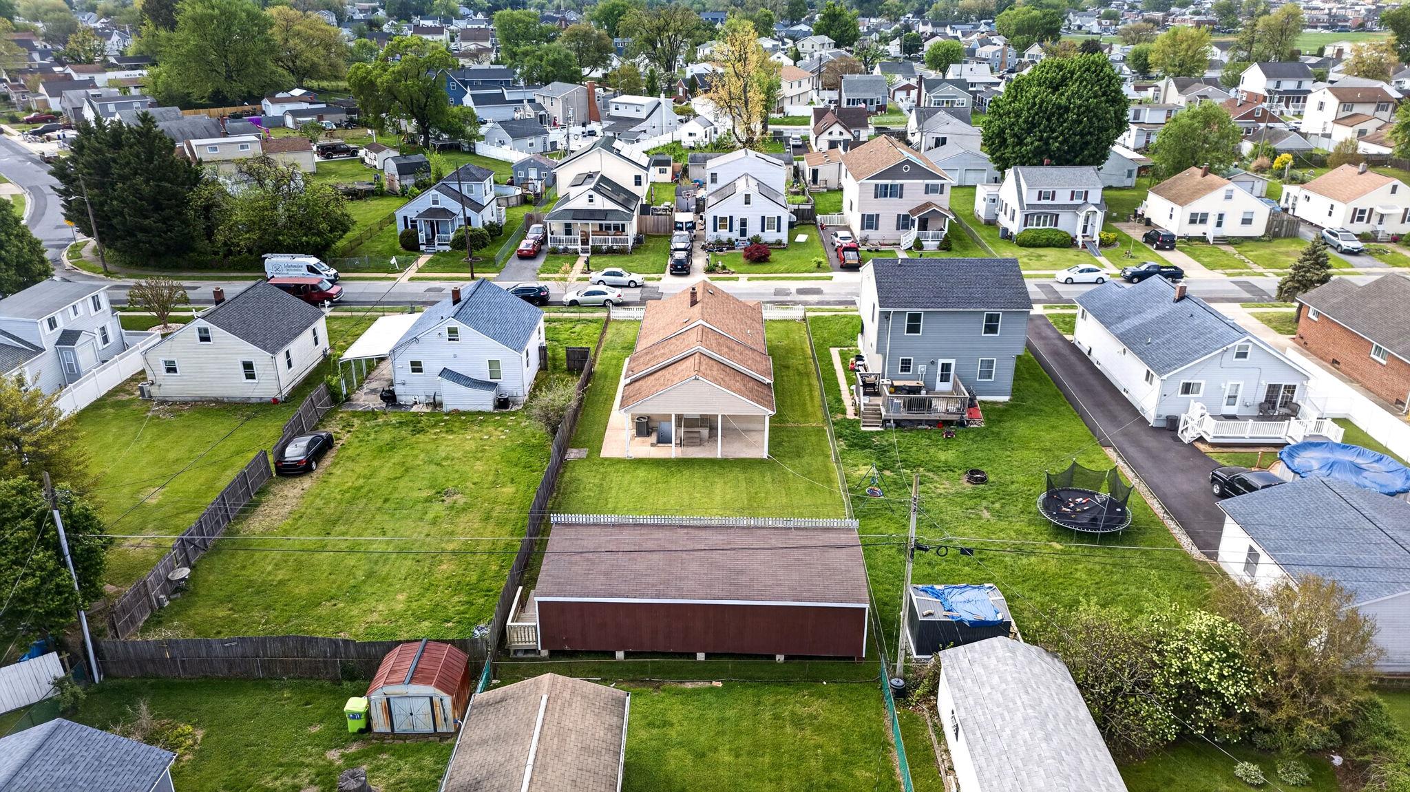 206 South Woodwell Road Baltimore, MD 21222 - Photo 39 of 46 an aerial view of multiple houses with yard