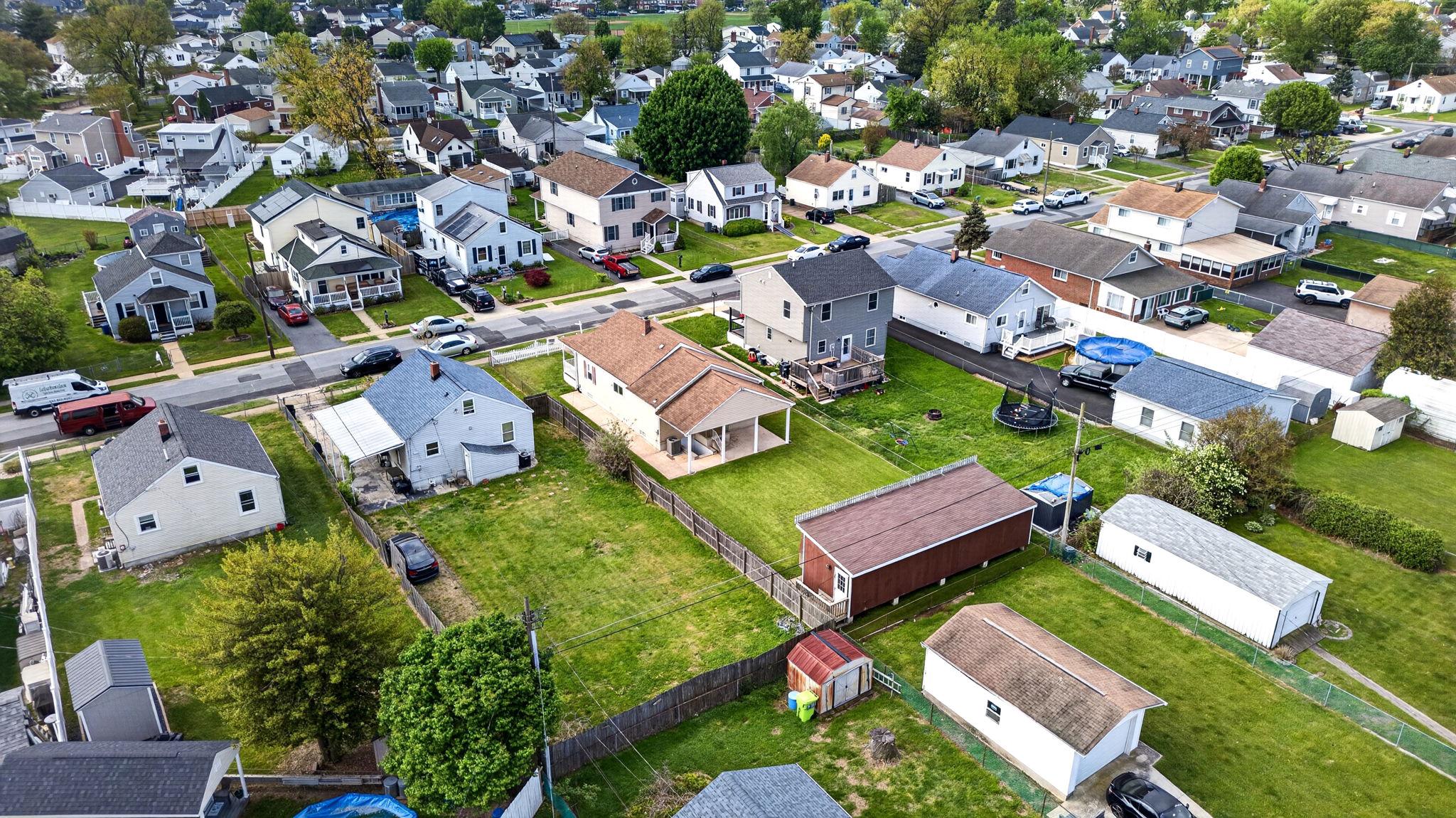 206 South Woodwell Road Baltimore, MD 21222 - Photo 40 of 46 an aerial view of a house with a garden and lake view