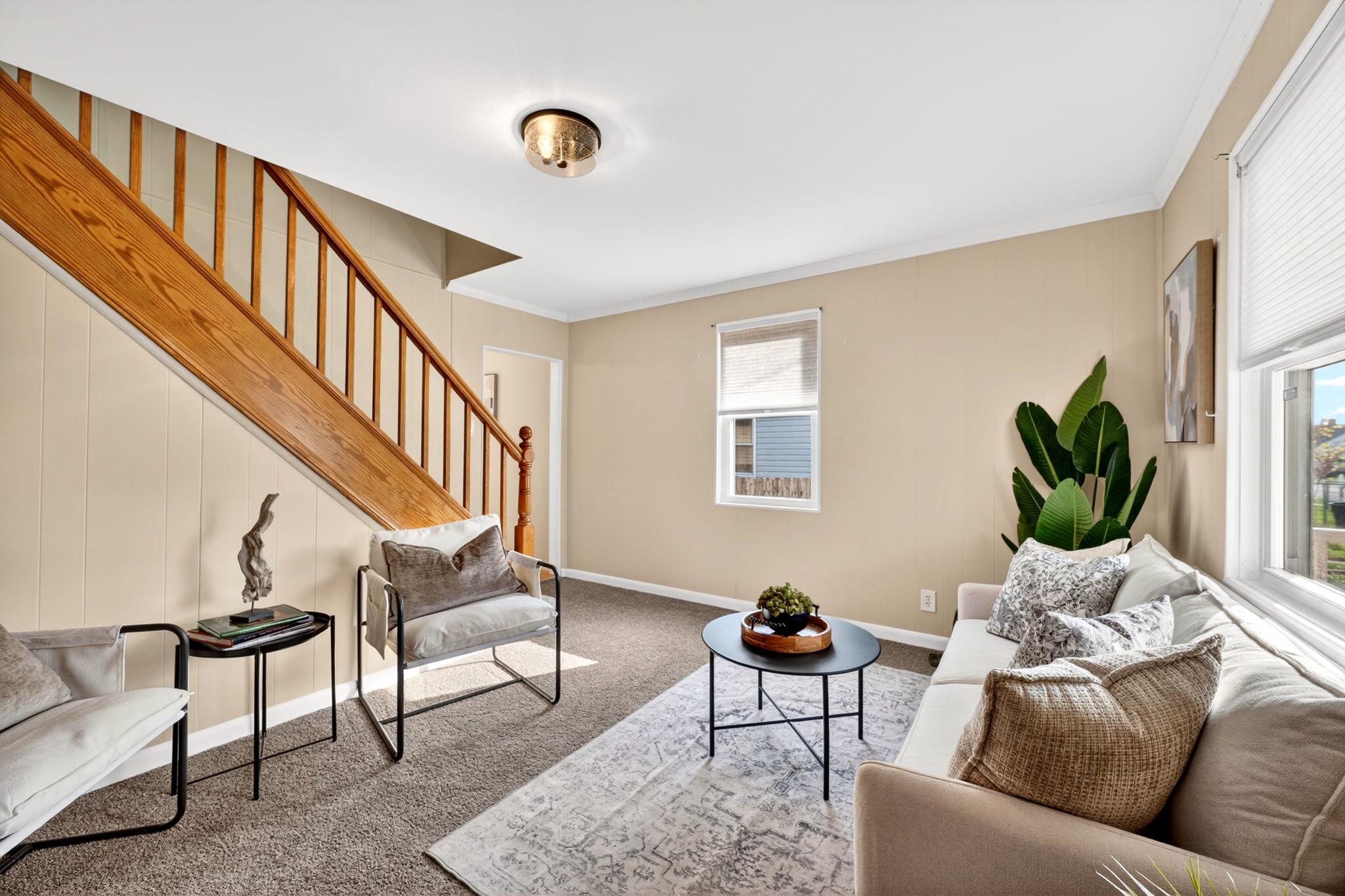 206 South Woodwell Road Baltimore, MD 21222 - Photo 4 of 46 a living room with furniture and a wooden floor