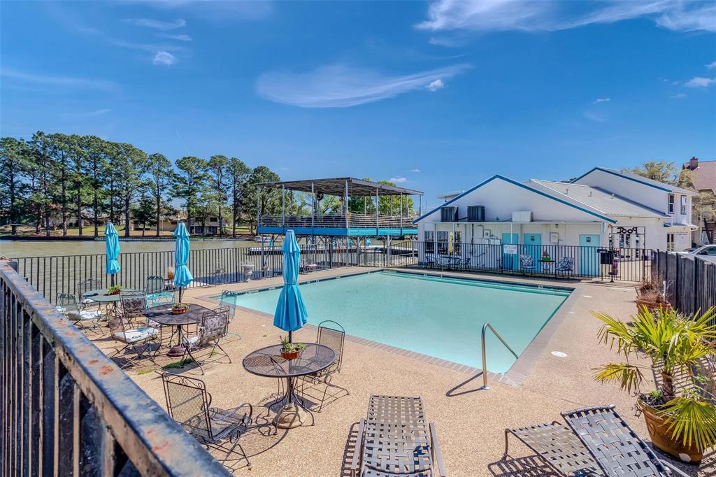 1933 Island Circle, Unit B106 Tool, TX 75143 - Photo 9 of 12 a view of a house with swimming pool and sitting area