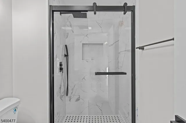 a view of wooden floor and windows in a room