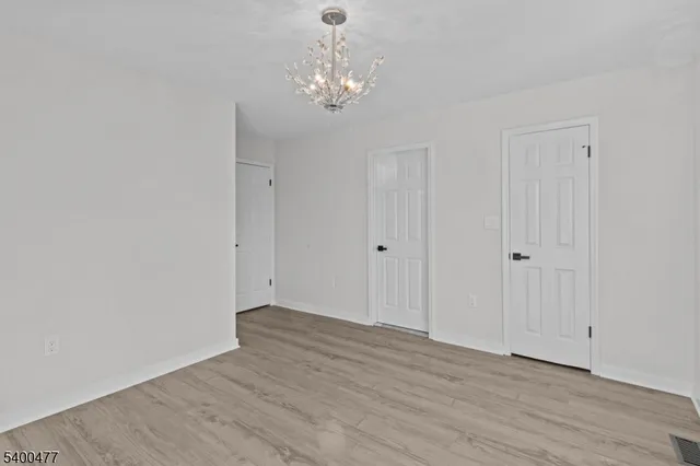 an aerial view of a house with a garden and swimming pool