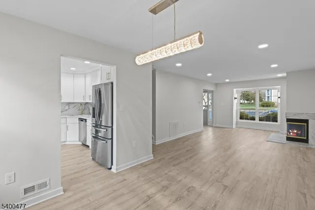 a room with a fireplace and a fireplace