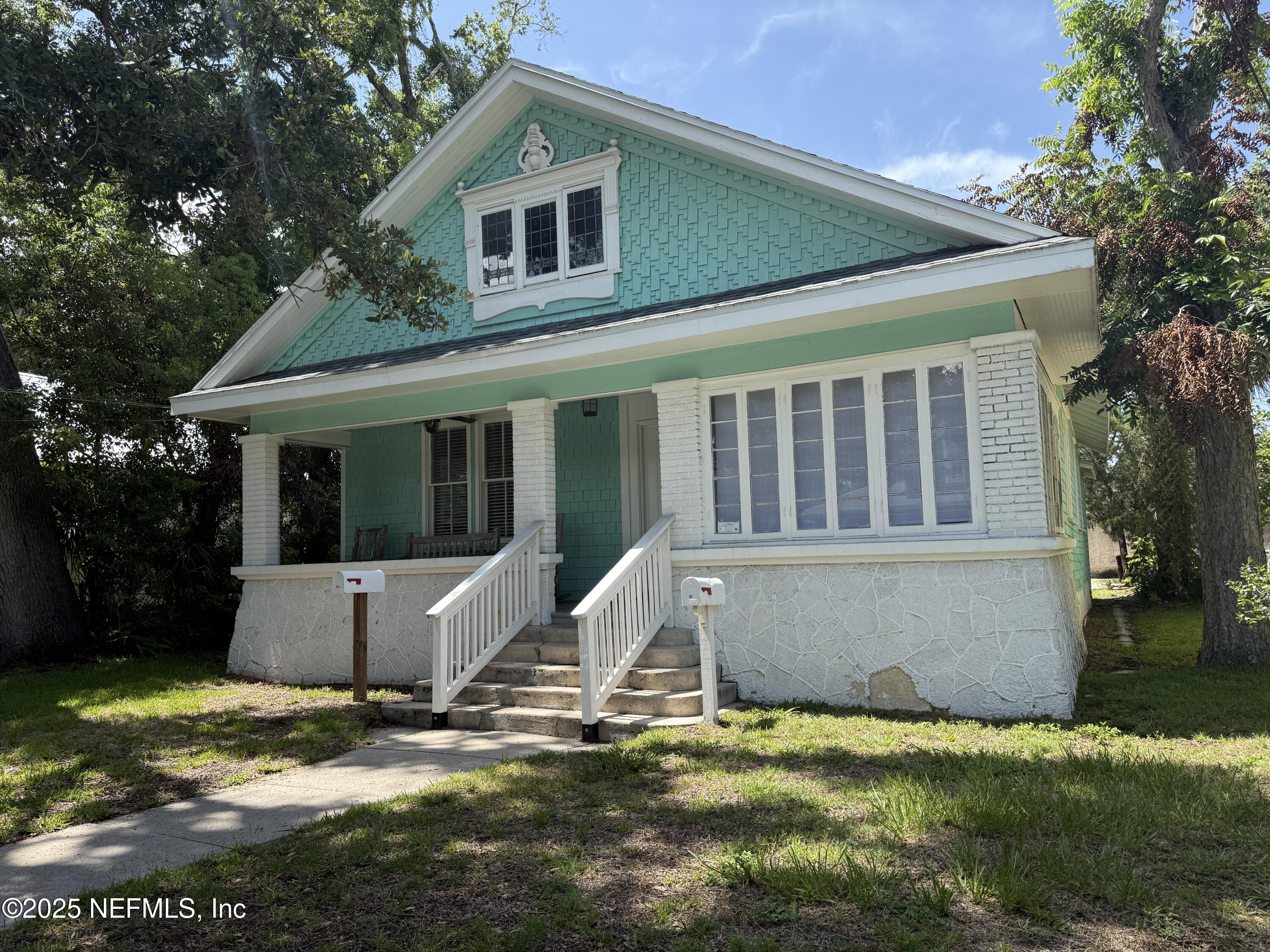 66 Lemon Street St. Augustine, FL 32084 - Photo 1 of 19 a view of house with yard and swimming pool