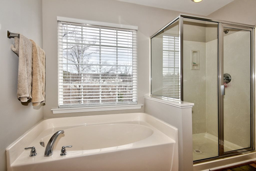 7754 San Gabriel Street Raleigh, NC 27613 - Photo 19 of 25 Soak into your garden tub and enjoy a good book and glass of wine! Master Bathroom