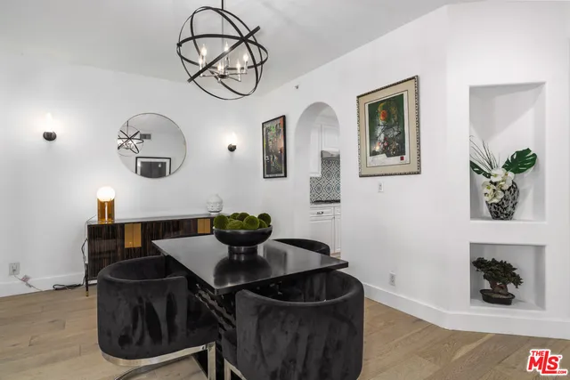 a living room with a fireplace and a flat screen tv