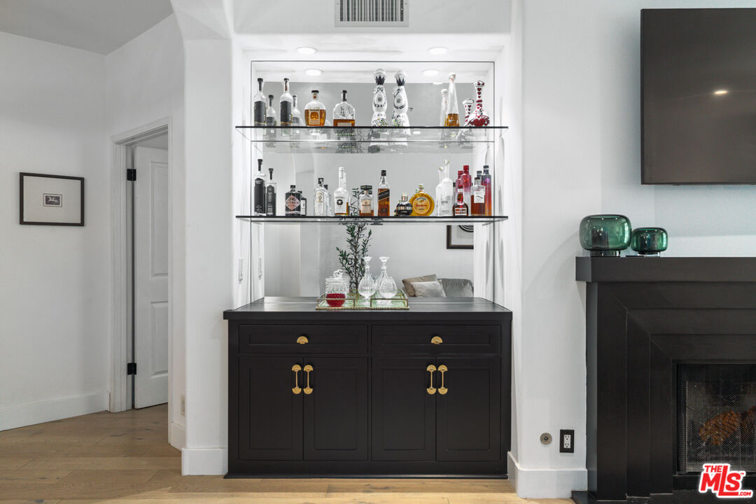 11740 Sunset Boulevard, Unit 14 Los Angeles, CA 90049 - Photo 23 of 44 a room with granite countertop lots of different kinds of food