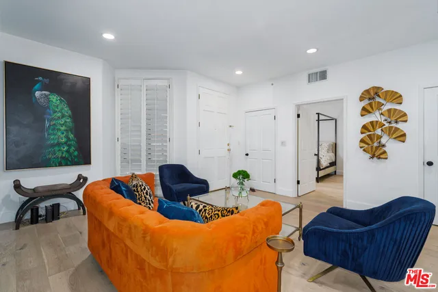 a kitchen with cabinets and stainless steel appliances