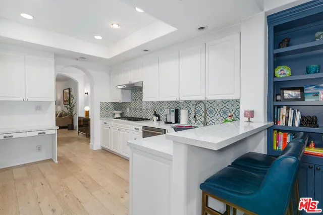 a living room with furniture potted plant and a window