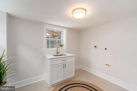 a room with a sink and a mirror