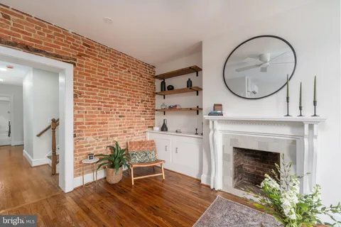 a view of a livingroom with furniture and a fireplace