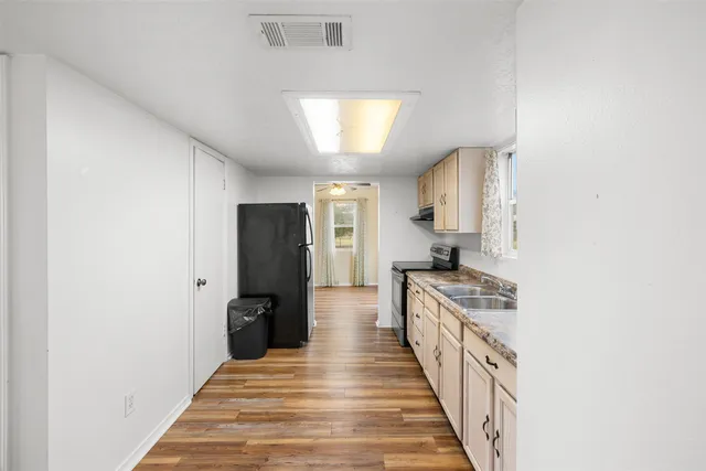 a kitchen with a stove and a refrigerator