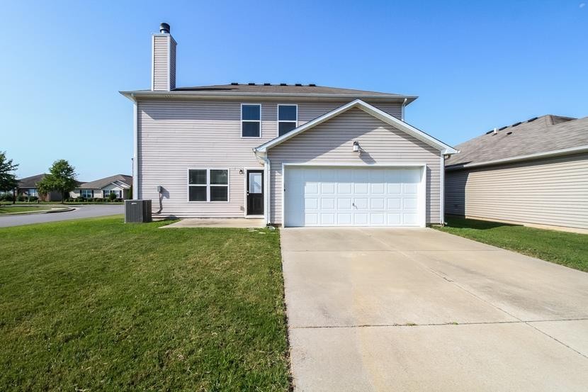 3704 Blaze Drive Murfreesboro, TN 37128 - Photo 17 of 17 a front view of a house with a yard and garage