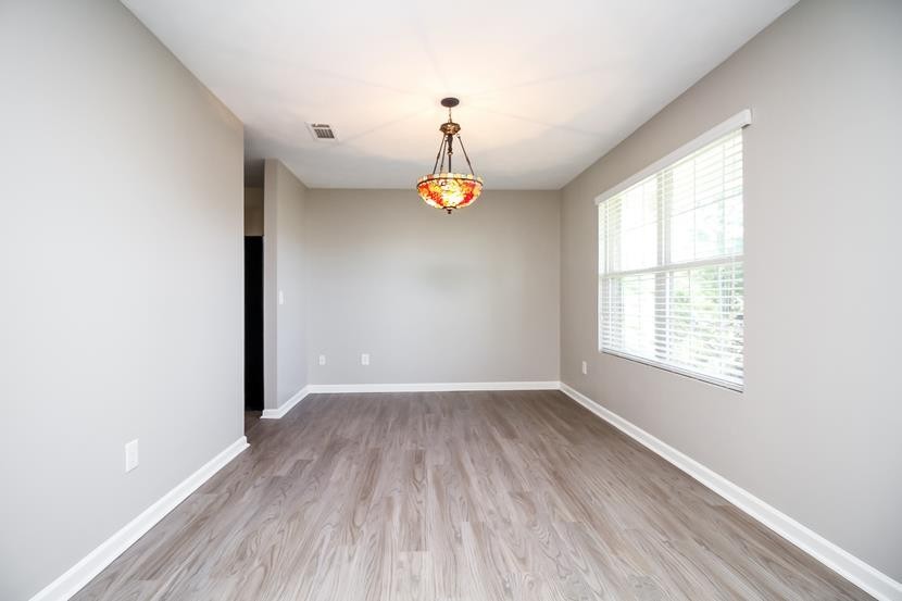 3704 Blaze Drive Murfreesboro, TN 37128 - Photo 6 of 17 a view of empty room with wooden floor and window
