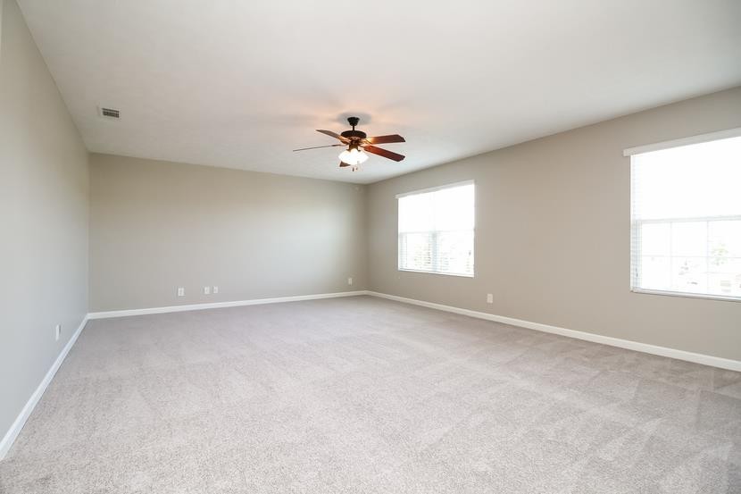 3704 Blaze Drive Murfreesboro, TN 37128 - Photo 9 of 17 an empty room with windows and chandelier fan