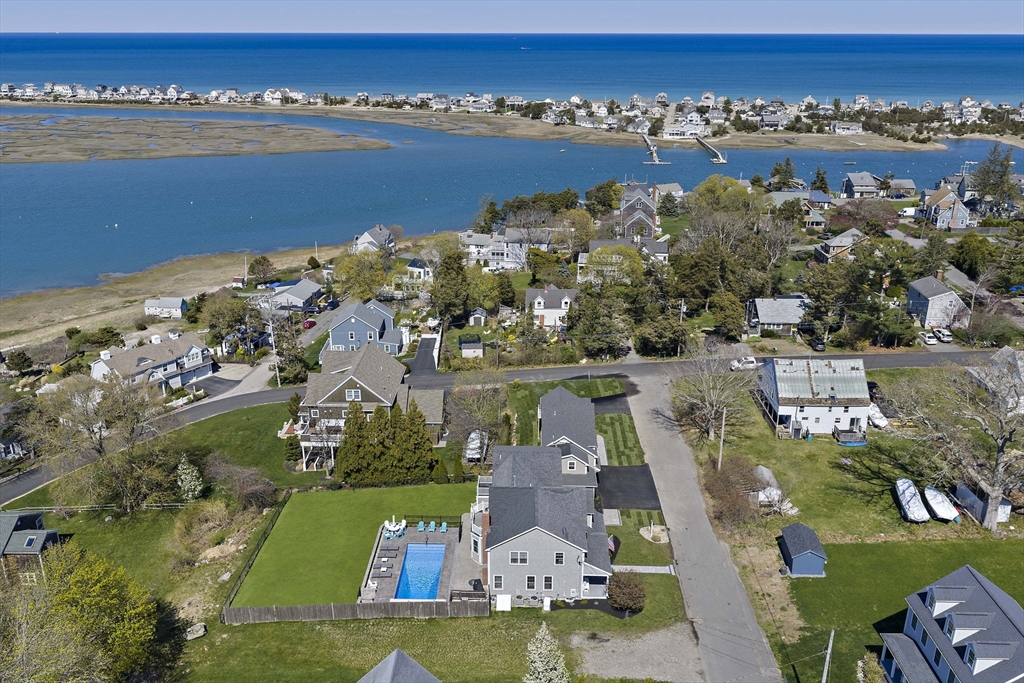 an aerial view of a house with a lake view