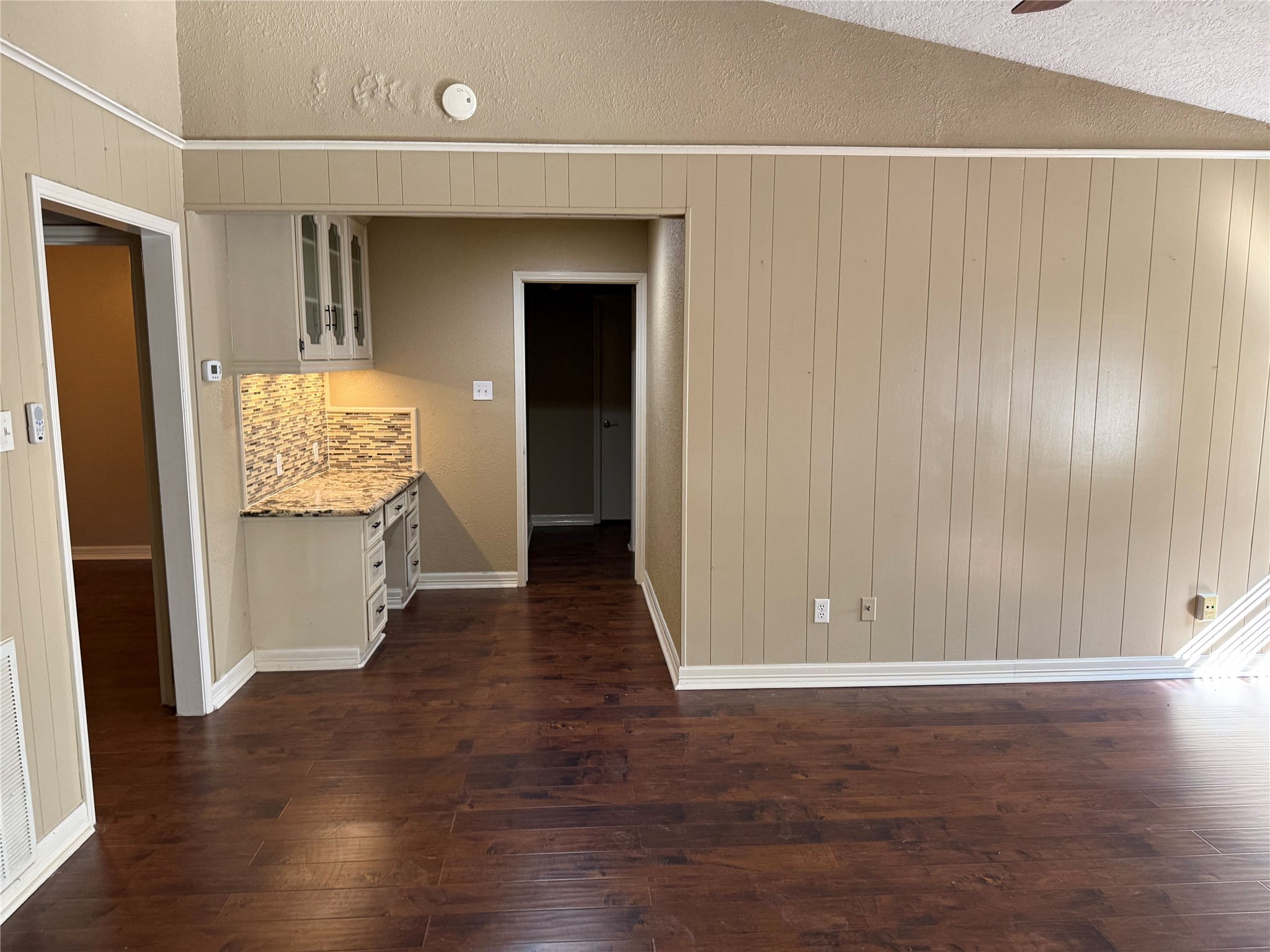 13726 Rampchester Lane Houston, TX 77015 - Photo 11 of 30 an empty room with wooden floor and windows