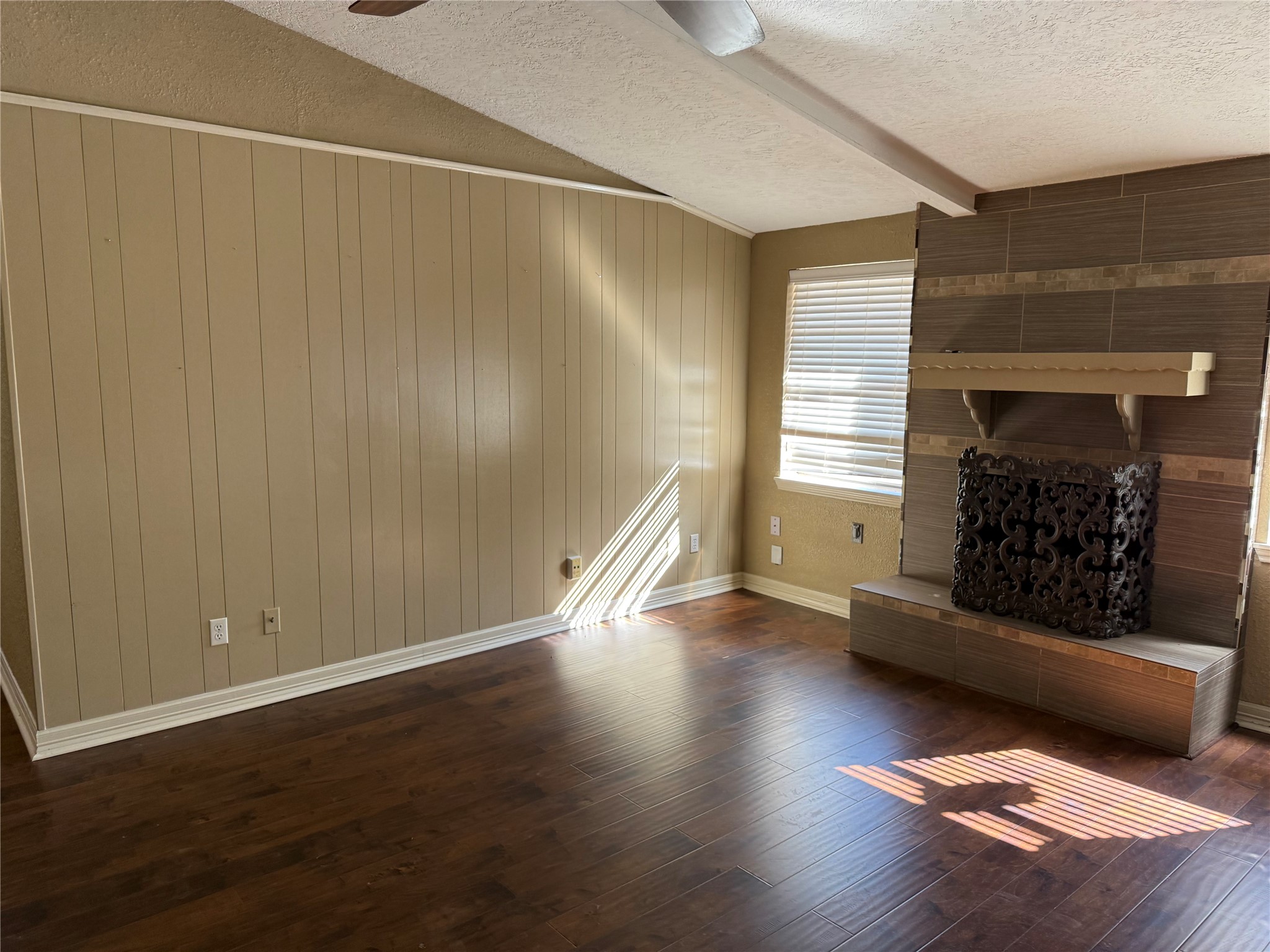 13726 Rampchester Lane Houston, TX 77015 - Photo 12 of 30 an empty room with wooden floor fire place and windows