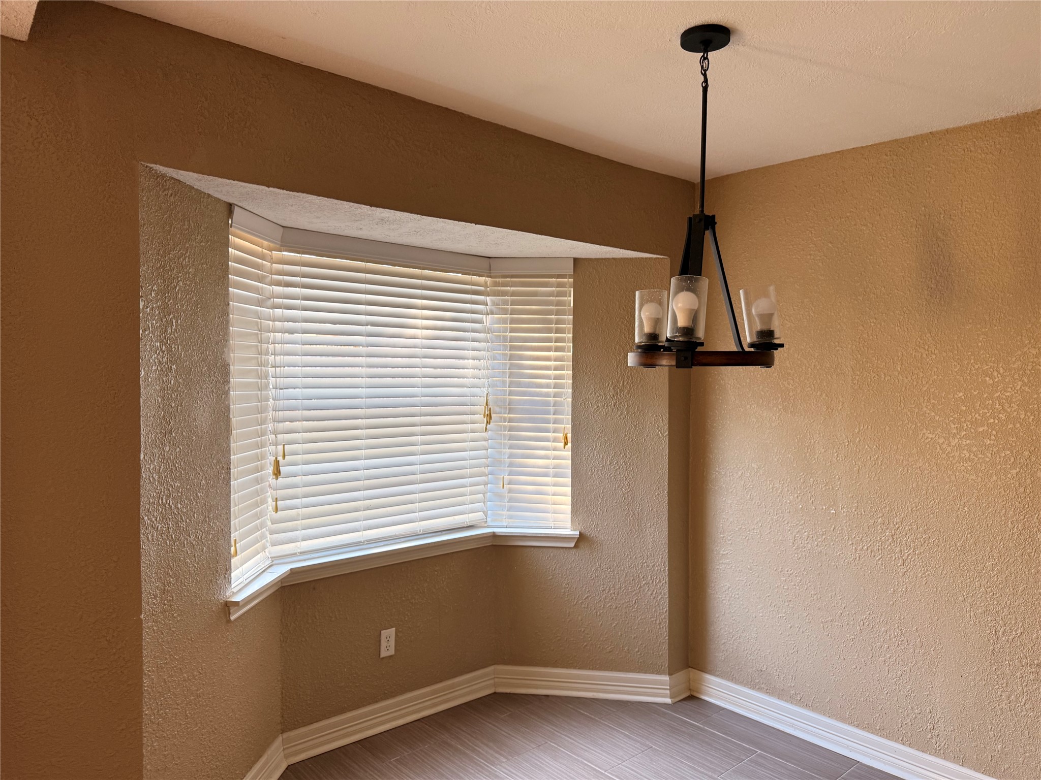 13726 Rampchester Lane Houston, TX 77015 - Photo 14 of 30 a view of a room with a window and wooden floor