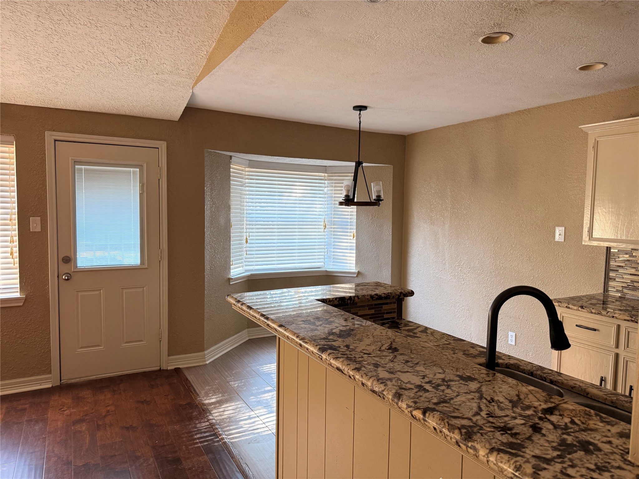 13726 Rampchester Lane Houston, TX 77015 - Photo 16 of 30 a kitchen with granite countertop a stove a sink dishwasher a refrigerator and wooden floor