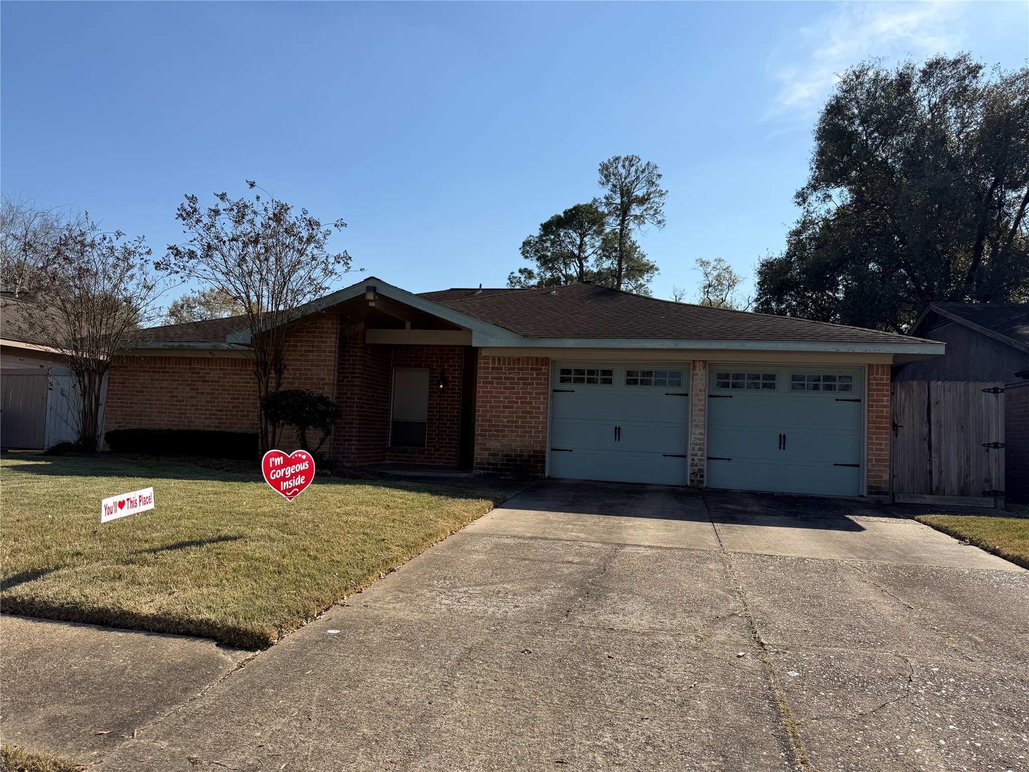 13726 Rampchester Lane Houston, TX 77015 - Photo 2 of 30 a view of a house with a yard and garage