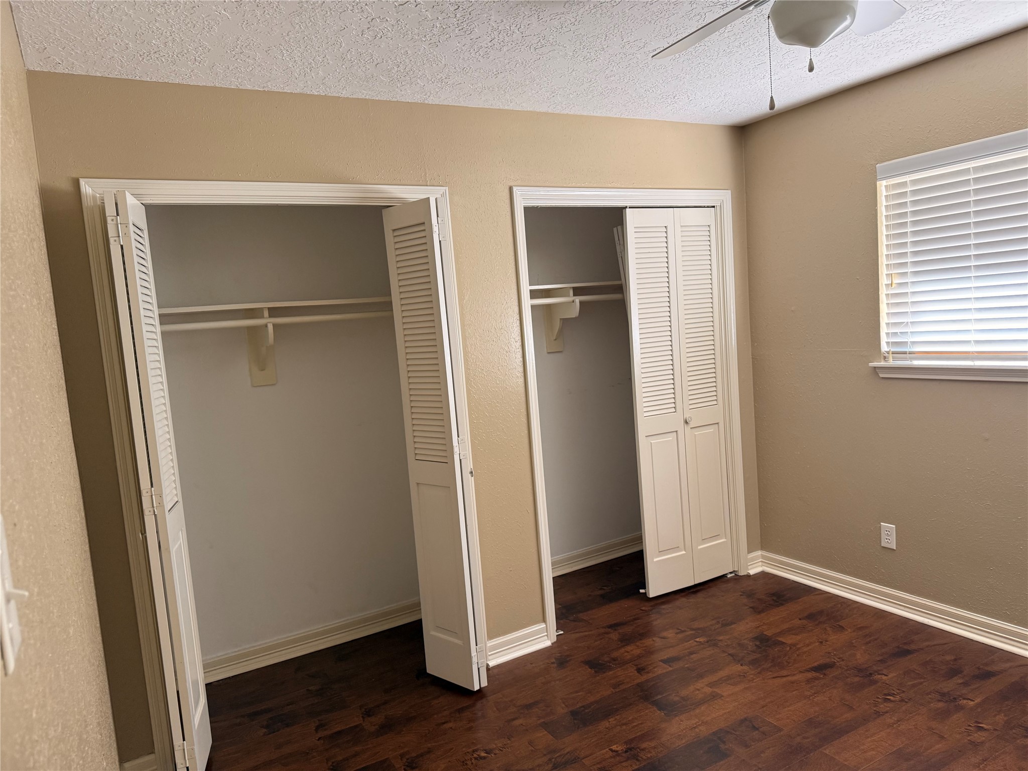 13726 Rampchester Lane Houston, TX 77015 - Photo 21 of 30 a view of an empty room with wooden floor and a window