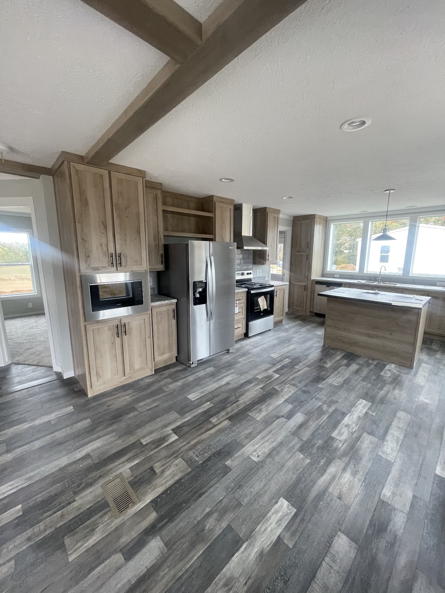 889 White Springs Road Lafayette, TN 37083 - Photo 5 of 9 a kitchen with granite countertop a refrigerator stove top oven and sink