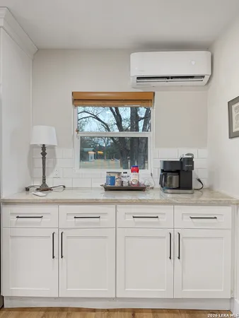 a bedroom with furniture and window