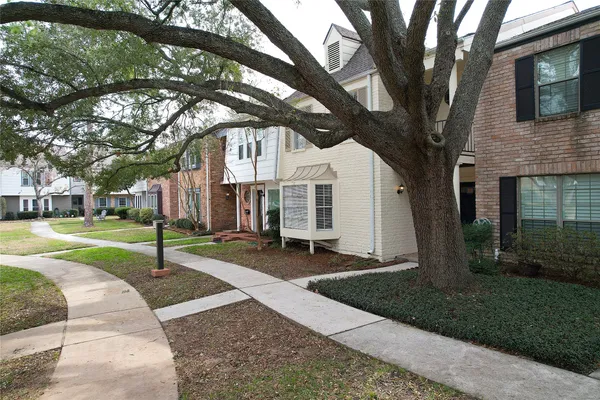 a house with trees in the background