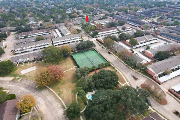 an aerial view of residential houses with outdoor space