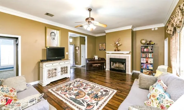 a living room with furniture and a fireplace