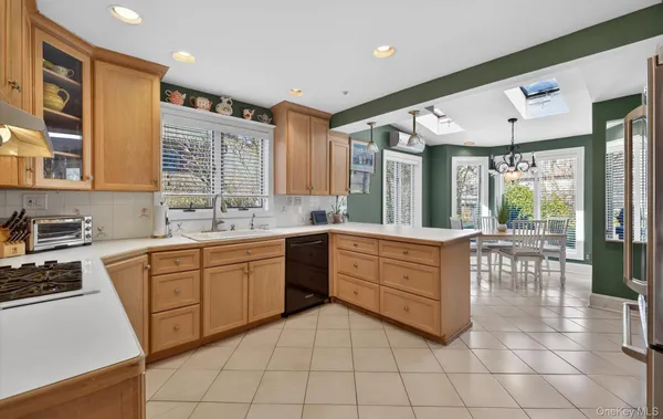 a large kitchen with a large window