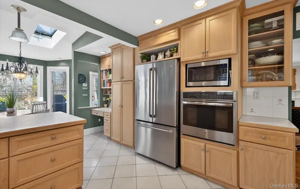 a kitchen with stainless steel appliances cabinets and a counter top space