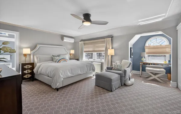 a bedroom with bed and window