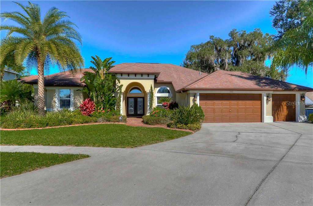 Stunning 4 bedroom, 3 bathroom home sitting on over ½ acre lot with additions and upgrades galore!